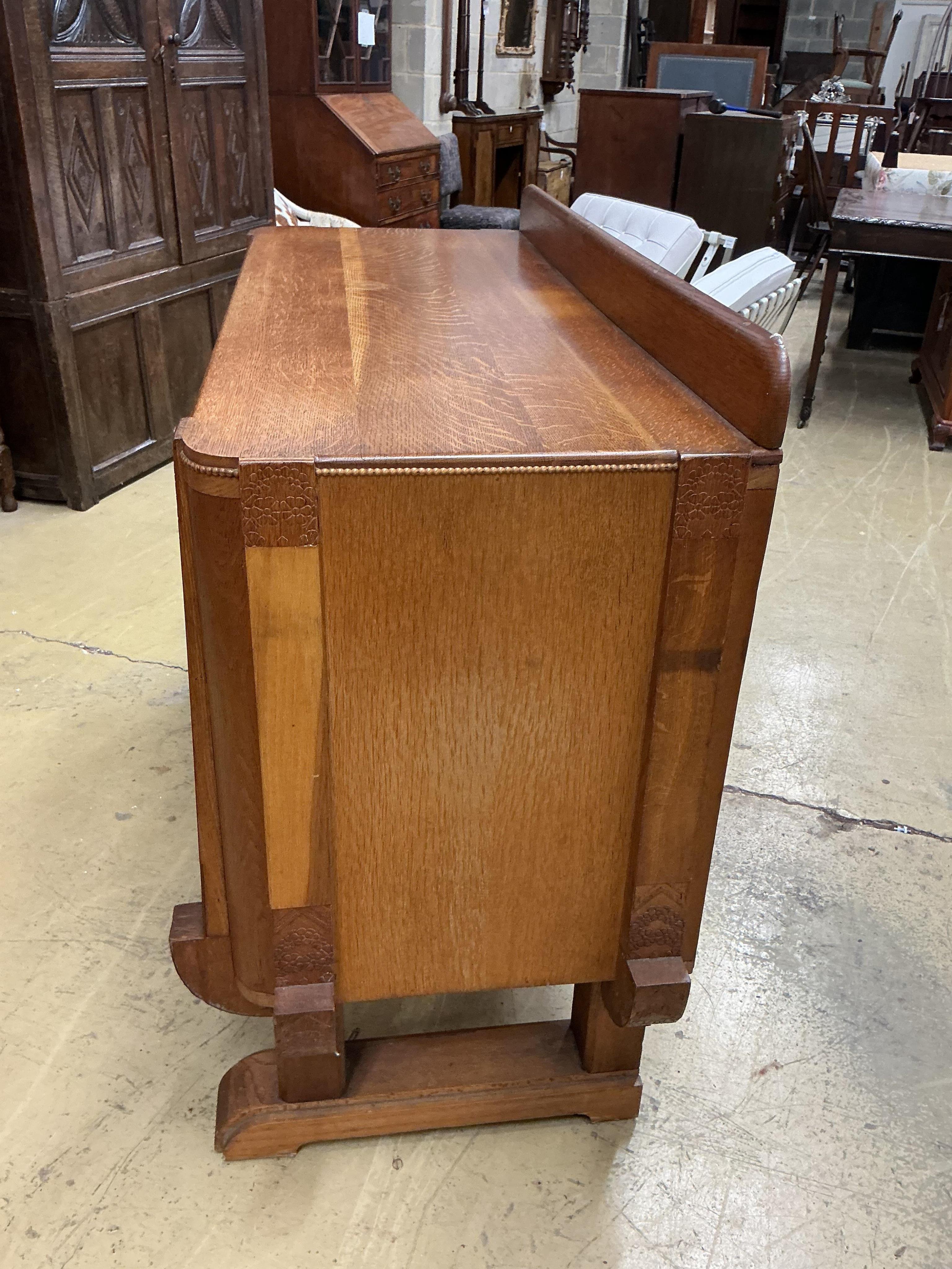 An Art Deco oak sideboard, width 134cm, depth 53cm, height 100cm